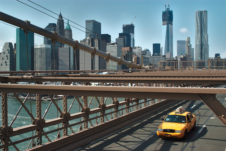 Yellow cab on Brooklyn Bridge
